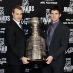 Los Angeles Kings' Dustin Brown, left, and Jonathan Quick pose with the Stanley Cup before the start of the NHL Awards, Wednesday, June 20, 2012, in Las Vegas. (AP Photo/Julie Jacobson)