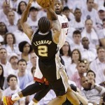 San Antonio Spurs small forward Kawhi Leonard (2) shoots against Miami Heat shooting guard Dwyane Wade (3) during the second half of Game 2 of the NBA Finals basketball game, Sunday, June 9, 2013 in Miami. (AP Photo/Lynne Sladky)