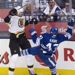 Boston Bruins defenseman Zdeno Chara, left, takes out Toronto Maple Leafs forward Nazem Kadri, right, during the third period of Game 3 of their first-round NHL hockey Stanley Cup playoff series, Monday, May 6, 2013, in Toronto. (AP Photo/The Canadian Press, Nathan Denette)