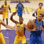 Dallas Mavericks' Brandan Wright, right, Los Angeles Lakers' Metta World Peace, center, and Los Angeles Lakers' Steve Nash go after a rebound in the first half of an NBA basketball game in Los Angeles, Tuesday, Oct. 30, 2012. (AP Photo/Jae C. Hong)