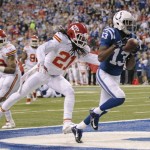 Indianapolis Colts wide receiver T.Y. Hilton (13) scores a touchdown against Kansas City Chiefs cornerback Dunta Robinson (21) during the first half of an NFL wild-card playoff football game Saturday, Jan. 4, 2014, in Indianapolis. (AP Photo/AJ Mast)