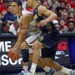  Arizona's Nick Johnson, left, struggles with California's Justin Cobbs, right, at midcourt in the second half of an NCAA college basketball game on Wednesday, Feb. 26, 2014, in Tucson, Ariz. Arizona won 87 - 59. (AP Photo/John MIller)
