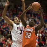 UTEP's Chris Washburn (32) shoots over Arizona's Grant Jerrett (33) during the first half of an NCAA college basketball game at McKale Center in Tucson, Ariz., Thursday, Nov.15, 2012. (AP Photo/Wily Low)
