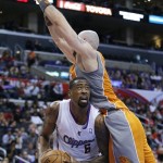 Los Angeles Clippers' DeAndre Jordan, bottom, looks to shoot as Phoenix Suns' Marcin Gortat, of Poland, defends during the first half of an NBA basketball game in Los Angeles, Saturday, Dec. 8, 2012. (AP Photo/Jae C. Hong)
