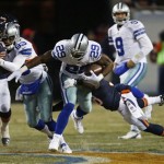 Dallas Cowboys running back DeMarco Murray (29) rushes against Chicago Bears cornerback Zack Bowman during the first half of an NFL football game, Monday, Dec. 9, 2013, in Chicago. (AP Photo/Charles Rex Arbogast)