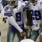 Dallas Cowboys quarterback Tony Romo (9) and Dallas Cowboys running back DeMarco Murray (29) warm their hands with heater on the sideline during the first half of an NFL football game against the Chicago Bears, Monday, Dec. 9, 2013, in Chicago. (AP Photo/Charles Rex Arbogast)