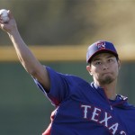 Texas Rangers starting pitcher Yu Darvish, from Japan, throws during a baseball spring training workout Thursday, Feb. 14, 2013, in Surprise, Ariz. (AP Photo/Charlie Riedel)
