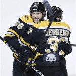 Boston Bruins center Patrice Bergeron (37) celebrates his goal against the Chicago Blackhawks with Bruins right wing Jaromir Jagr (68), of the Czech Republic, during the third period in Game 4 of the NHL hockey Stanley Cup Finals, Wednesday, June 19, 2013, in Boston. (AP Photo/Charles Krupa)