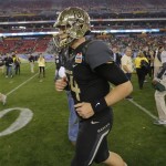 Baylor quarterback Bryce Petty (14) leaves the field after the Fiesta Bowl NCAA college football game, Wednesday, Jan. 1, 2014, in Glendale, Ariz. Central Florida won 52-42. (AP Photo/Matt York)