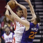  Houston Rockets' Francisco Garcia (32) looks to pass the ball as Phoenix Suns' Miles Plumlee (22) defends during the first quarter of an NBA basketball game Wednesday, Dec. 4, 2013, in Houston. (AP Photo/David J. Phillip)