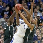 Michigan State forward Branden Dawson, left, and guard Denzel Valentine, right, pressure Kentucky guard James Young during the second half of an NCAA college basketball game Tuesday, Nov. 12, 2013, in Chicago. Michigan State won 78-74. (AP Photo/Charles Rex Arbogast)