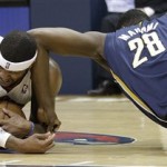 Atlanta Hawks small forward Josh Smith (5) and Indiana Pacers center Ian Mahinmi (28) vie for a loose ball during the second half in Game 4 of their first-round NBA basketball playoff series,basketball game Monday, April 29, 2013 in Atlanta. (AP Photo/John Bazemore)