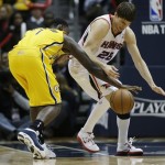 Atlanta Hawks small forward Kyle Korver (26) and Indiana Pacers shooting guard Lance Stephenson (1) vie for a loose ball during the second half of an NBA first-round playoff basketball game, in Atlanta, Friday, May 3, 2013. (AP Photo/John Bazemore)