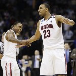 Arizona's Lamont Jones reacts after forward Derrick Williams, right, blocked a shot by Memphis' Wesley Witherspoon's in the final seconds of play at a West Regional NCAA tournament second round college basketball game, Friday, March 18, 2011 in Tulsa, Okla. Arizona won 77-75. (AP Photo/Charlie Riedel)