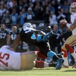 San Francisco 49ers Colin Kaepernick, right, looks to pass during a divisional playoff NFL football game against the Carolina Panthers, Sunday, Jan. 12, 2014, in Charlotte, N.C. (AP Photo/The Star, Ben Earp)