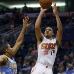 Phoenix Suns shooting guard Gerald Green (14), right, shoots over Denver Nuggets point guard Andre Miller (24) in the third quarter during an NBA basketball game on Friday, Nov. 8, 2013, in Phoenix. The Suns defeated the Nuggets 114-93. (AP Photo/Rick Scuteri)
