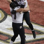 Baltimore Ravens tight end Dennis Pitta (88) celebrates his 1-yard touchdown reception with center Matt Birk (77) against the San Francisco 49ers during the first half of the NFL Super Bowl XLVII football game, Sunday, Feb. 3, 2013, in New Orleans. (AP Photo/Gerald Herbert)