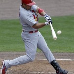 St. Louis Cardinals' Carlos Beltran hits a double during the third inning of an exhibition spring training baseball game against the New York Mets, Wednesday, Feb. 27, 2013, in Port St. Lucie, Fla. (AP Photo/Julio Cortez)