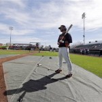 San Francisco Giants' Brandon Crawford waits his turn to take batting practice before an exhibition spring training baseball game against the Texas Rangers on Friday, March 15, 2013 in Scottsdale, Ariz. (AP Photo/Marcio Jose Sanchez)