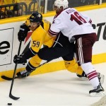 Nashville Predators defenseman Roman Josi (59), of Switzerland, is checked by Phoenix Coyotes defenseman Rostislav Klesla (16), of the Czech Republic, in the second period of Game 4 in an NHL hockey Stanley Cup Western Conference semifinal playoff series, Friday, May 4, 2012, in Nashville, Tenn. (AP Photo/Mike Strasinger)