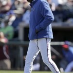 Texas Rangers manager Ron Washington walks to the mound to make a pitching change during an exhibition spring training baseball game against the Chicago White Sox Tuesday, Feb. 26, 2013, in Surprise, Ariz. (AP Photo/Charlie Riedel)