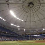 The Tampa Bay Rays and Arizona Diamondbacks leave the field after a portion of the lights at Tropicana field went out during an electrical storm in the second inning of an interleague baseball game Tuesday, July 30, 2013, in St. Petersburg, Fla. (AP Photo/Chris O'Meara)