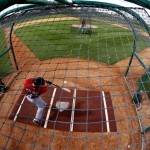 St. Louis Cardinals catcher Yadier Molina takes batting practice during the team's first pitchers and catchers workout spring training baseball, Tuesday, Feb. 12, 2013, in Jupiter, Fla. (AP Photo/Julio Cortez)