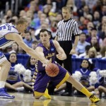 Albany's Sam Rowley, right, tries to pass the ball past Duke's Mason Plumlee during the first half of a second-round game of the NCAA college basketball tournament, Friday, March 22, 2013, in Philadelphia. (AP Photo/Matt Slocum)