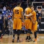  Phoenix Suns' Goran Dragic, right, of Slovenia, embraces Markieff Morris (11) as Marcus Morris (15) looks on during the second half of an NBA basketball game against the New Orleans Pelicans, Friday, Feb. 28, 2014, in Phoenix. The Suns won 116-104. (AP Photo/Matt York)