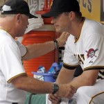 Pittsburgh Pirates pitching coach Ray Searage, left, talks with relief pitcher Jared Hughes in the dugout after Hughes was taken out after giving up two runs in the seventh inning of a baseball game against the Arizona Diamondbacks, Thursday, Aug. 9, 2012, in Pittsburgh. The Diamondbacks won 6-3. (AP Photo/Keith Srakocic)