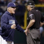 Tampa Bay Rays manager Joe Maddon, left, argues a call with first base umpire Paul Emmel in the eighth inning in Game 3 of an American League baseball division series against the Boston Red Sox, Monday, Oct. 7, 2013, in St. Petersburg, Fla. (AP Photo/Chris O'Meara)