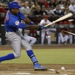 Chicago Cubs' Alfonso Soriano breaks his bat as he hits a slow ground ball for an out against the Arizona Diamondbacks during the first inning in a baseball game Tuesday, July 23, 2013, in Phoenix. (AP Photo/Ross D. Franklin)