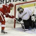 Detroit Red Wings left wing Johan Franzen (93), of Sweden, tries to score on Anaheim Ducks goalie Jonas Hiller (1), of Switzerland, in the third period of Game 4 of a first-round NHL hockey Stanley Cup playoff series in Detroit, Monday, May 6, 2013. (AP Photo/Paul Sancya)