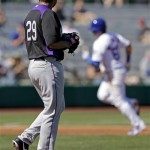  Colorado Rockies' Jorge De La Rosa watches as Chicago Cubs' Christian Villanueva rounds the bases after Villanueva hit a home run during the third inning of an exhibition spring training baseball game Tuesday, Feb. 26, 2013, in Phoenix. (AP Photo/Morry Gash)