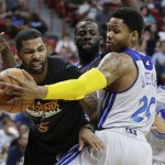 Golden State Warriors guard Kent Bazemore (20) deflects a pass by Phoenix Suns' Marcus Morris in the fourth quarter of the NBA Summer League championship game, Monday, July 22, 2013, in Las Vegas. The Warriors won 91-77. (AP Photo/Julie Jacobson)
