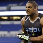 Missouri defensive lineman Michael Sam runs a drill at the NFL football scouting combine in Indianapolis, Monday, Feb. 24, 2014. (AP Photo/Michael Conroy)