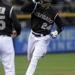 Colorado Rockies' Dexter Fowler (24) tips his helmet as he rounds third base after hitting a solo home run off Arizona Diamondbacks starting pitcher Daniel Hudson during the first inning of a baseball game on Friday, April 13, 2012, in Denver. (AP Photo/Jack Dempsey)
