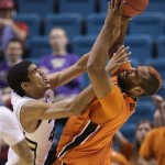 Oregon State's Joe Burton, right, pulls down a rebound against Colorado's Josh Scott in the second half during a Pac-12 tournament NCAA college basketball game on Wednesday, March 13, 2013, in Las Vegas. Colorado won 74-68. (AP Photo/Julie Jacobson)