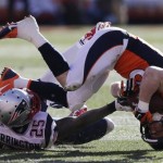  Denver Broncos wide receiver Wes Welker (83) is upended by New England Patriots cornerback Kyle Arrington (25) during the first half of the AFC Championship NFL playoff football game in Denver, Sunday, Jan. 19, 2014. (AP Photo/Julie Jacobson)
