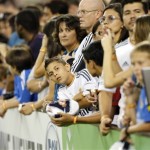 Fans wait for players to come out prior to a Real Madrid-Los Angeles Galaxy soccer match in the International Champions Cup, Thursday, Aug. 1, 2013, in Glendale, Ariz. (AP Photo/Matt York)