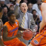 Marquette coach Buzz Williams gestures during the first half of his team's NCAA men's college basketball tournament West Regional semifinal against Florida on Thursday, March 22, 2012, in Phoenix. (AP Photo/Matt York)