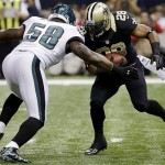 New Orleans Saints running back Mark Ingram (28) rushes against Philadelphia Eagles defensive end Trent Cole (58) during the first half of an NFL football game at Mercedes-Benz Superdome in New Orleans, Monday, Nov. 5, 2012. (AP Photo/Bill Haber)