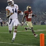  Auburn's Nick Marshall (14) gets past Florida State's Telvin Smith (22) for a touchdown run during the first half of the NCAA BCS National Championship college football game Monday, Jan. 6, 2014, in Pasadena, Calif. (AP Photo/David J. Phillip)