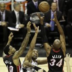 Miami Heat's Udonis Haslem (40) San Antonio Spurs' Tim Duncan (21) and Ray Allen (34) go after a loose ball during the first half at Game 5 of the NBA Finals basketball series, Sunday, June 16, 2013, in San Antonio. (AP Photo/David J. Phillip)
