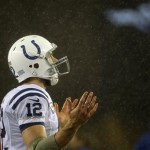 Indianapolis Colts quarterback Andrew Luck looks up at the rain before an AFC divisional NFL playoff football game against the New England Patriots in Foxborough, Mass., Saturday, Jan. 11, 2014. (AP Photo/Matt Slocum)