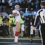  San Francisco 49ers quarterback Colin Kaepernick (7) celebrates after scoring a touchdown against the Carolina Panthers during the second half of a divisional playoff NFL football game, Sunday, Jan. 12, 2014, in Charlotte, N.C. (AP Photo/John Bazemore)