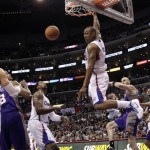 Los Angeles Clippers' Caron Butler, center, dunks during the second half of an NBA basketball game against the Phoenix Suns in Los Angeles, Thursday, March 15, 2012. The Suns won 91-87. (AP Photo/Jae C. Hong)