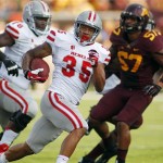UNLV running back Tim Cornett (35) runs for a touchdown in front of Minnesota linebacker Aaron Hill (57) during the first quarter of their NCAA college football game, Thursday Aug. 29, 2013, in Minneapolis. (AP Photo/Andy Clayton-King)