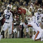  Auburn's Jermaine Whitehead (9) trips Florida State's Kelvin Benjamin after a catch during the second half of the NCAA BCS National Championship college football game Monday, Jan. 6, 2014, in Pasadena, Calif. (AP Photo/David J. Phillip)