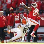 Cleveland Browns tight end Jordan Cameron (84) catches the ball while covered by Kansas City Chiefs cornerback Sean Smith (27) during the second half of an NFL football game in Kansas City, Mo., Sunday, Oct. 27, 2013. (AP Photo/Ed Zurga)